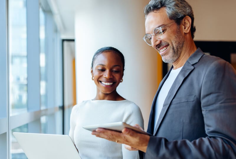 two people looking at a tablet