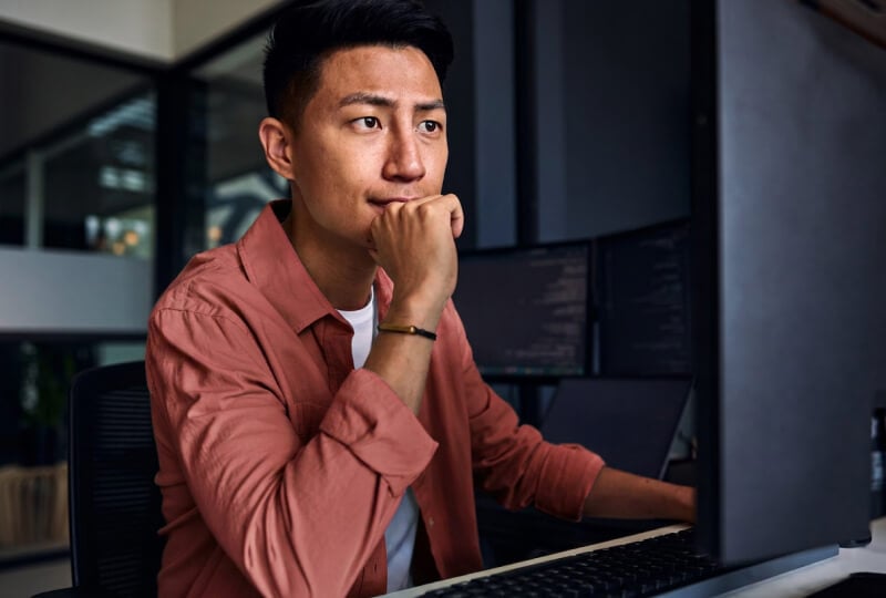 man looking at a computer screen
