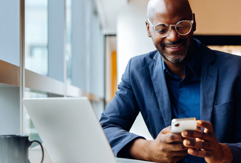 man looking at his mobile device