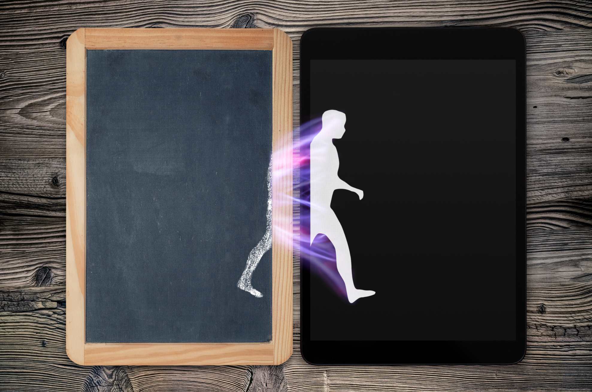 man walking from chalkboard on tablet