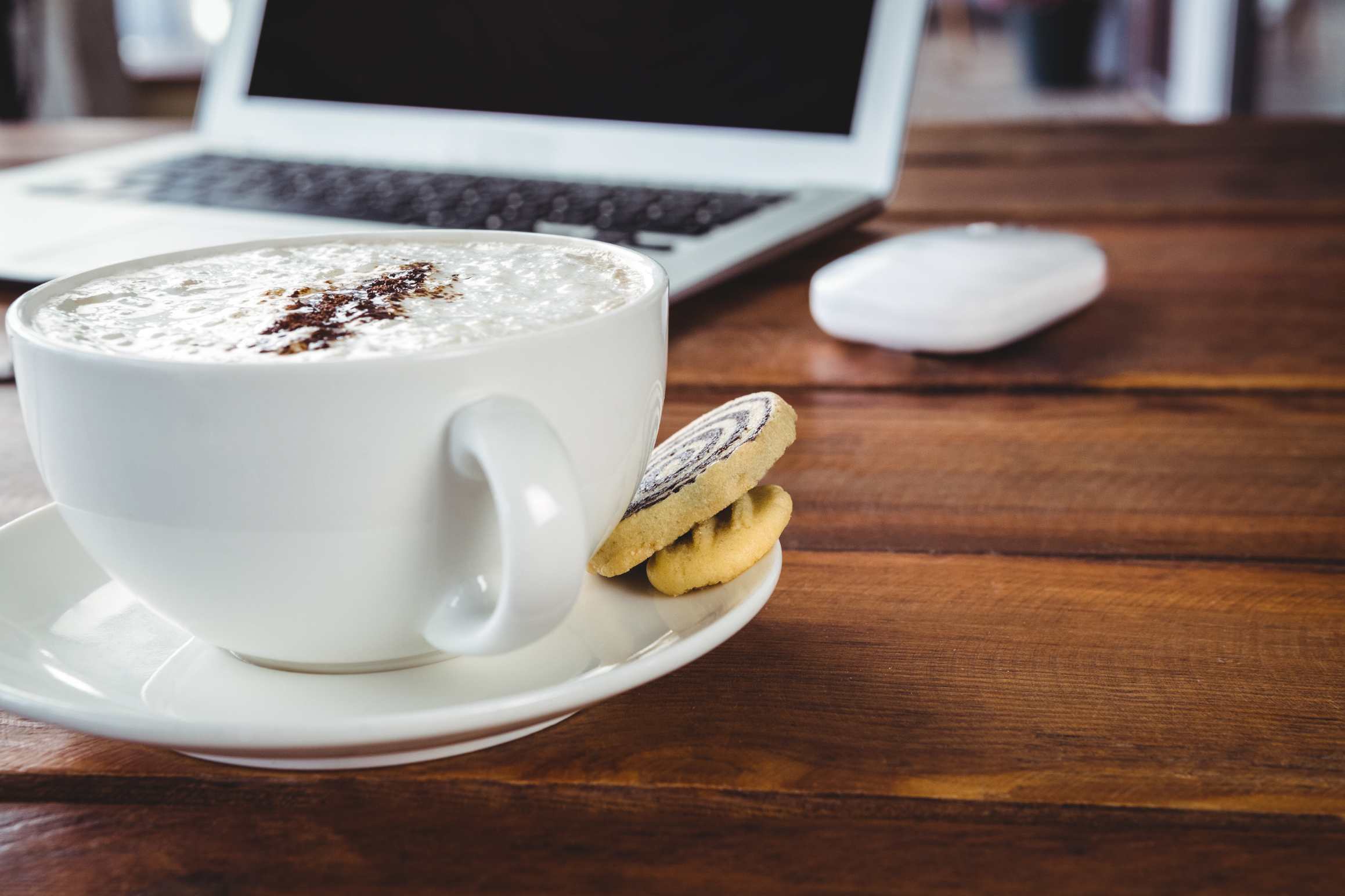 cookies and cocoa in front of laptop