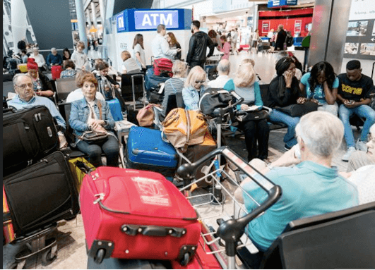 people waiting at airport terminal