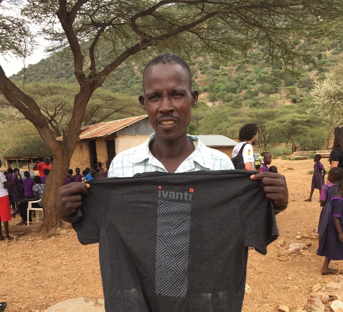 Kenyan holding Ivanti shirt