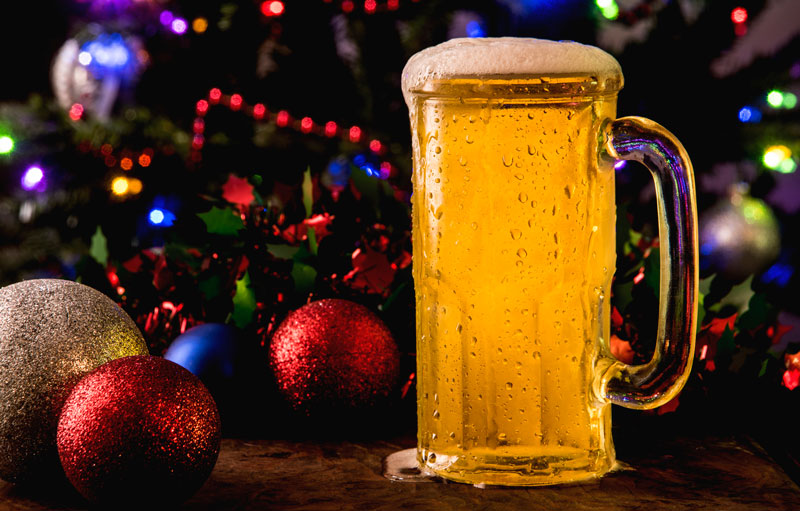 pitcher of beer in front of xmas tree