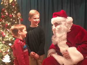 santa talking to 2 kids
