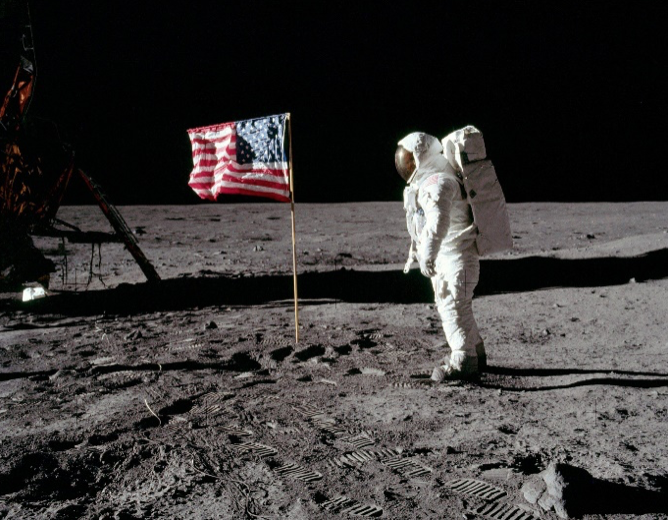 astronaut on moon w american flag