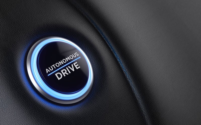 autonomous drive button on car wheel 