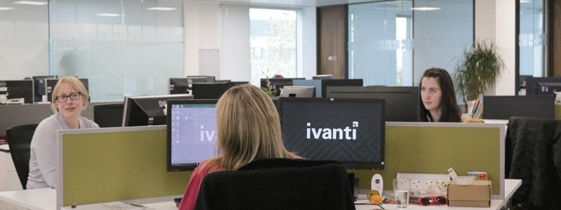 ivanti office space w 3 employees in picture at their desks