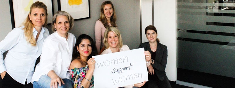 frankfurt group of women holding women support women sign
