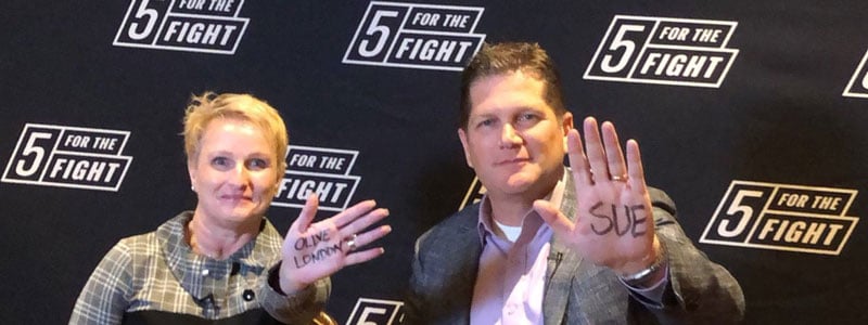 5 For The Fight - photo of 2 individuals holding up hands w sharpie on them 