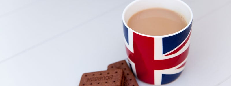 british flag cup of coffee w cookie on side