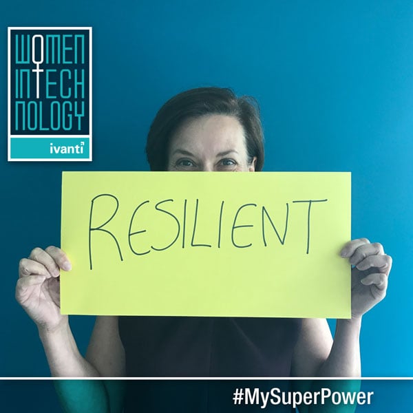 women in technology - woman holding resilient sign