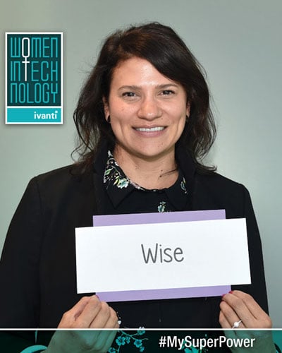 women in technology - woman holding wise sign