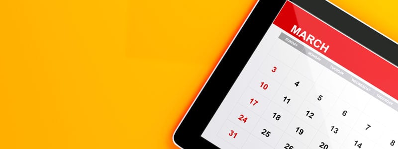 march calender on tablet graphic - yellow background