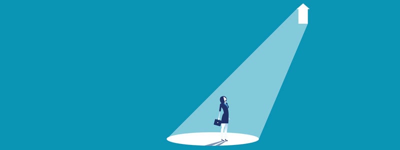 business woman w light shining down on her from white arrow graphic - blue background
