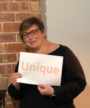 woman holding unique sign