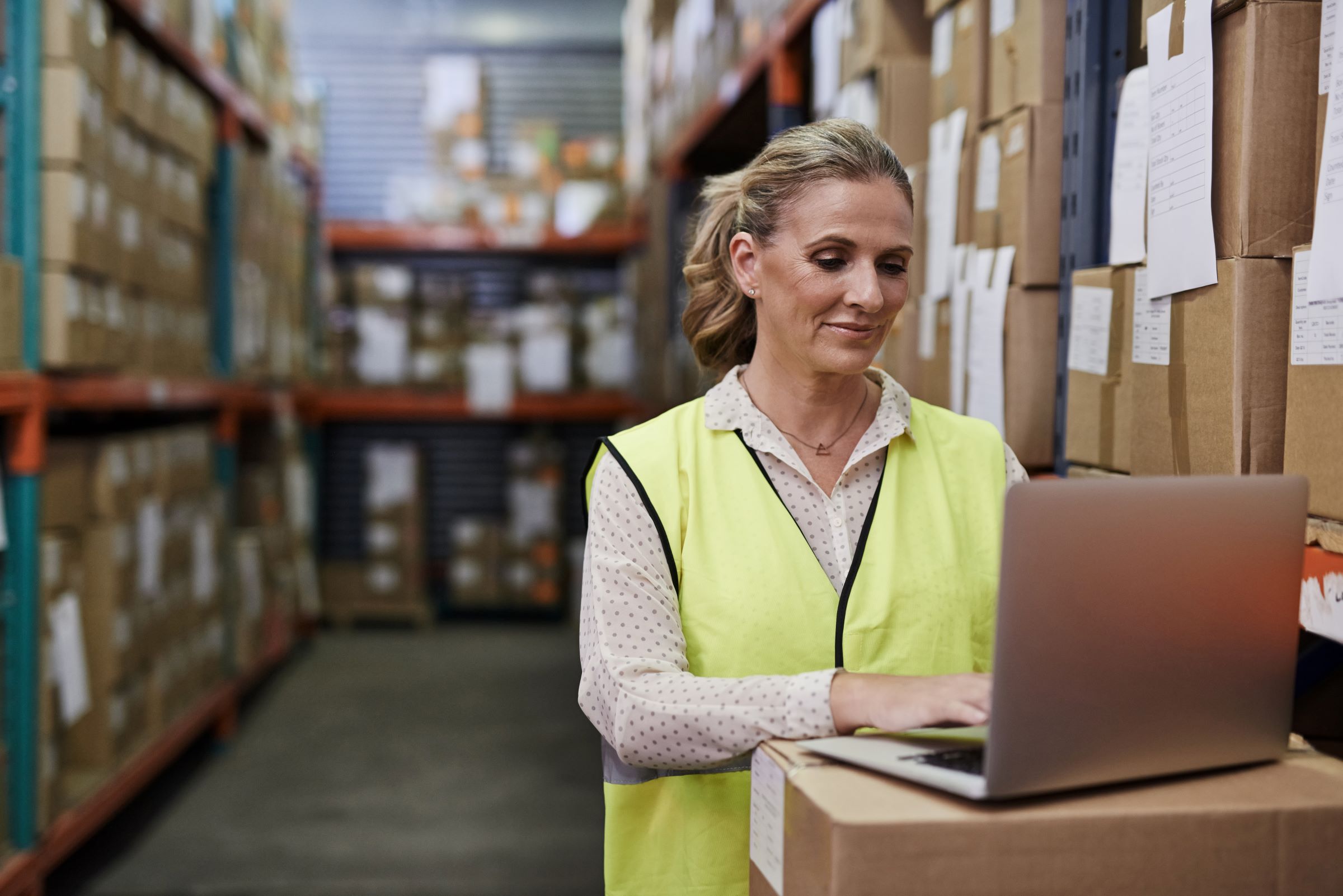 woman using managed device in warehouse