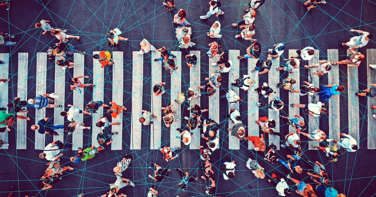 Overhead shot of people crossing a crosswalk, with lines drawn between them.
