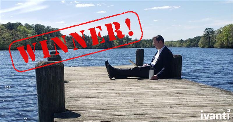 man working on a dock with the word 'winner' stamped on the photo