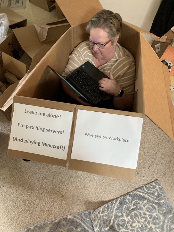 a woman working in a cardboard box