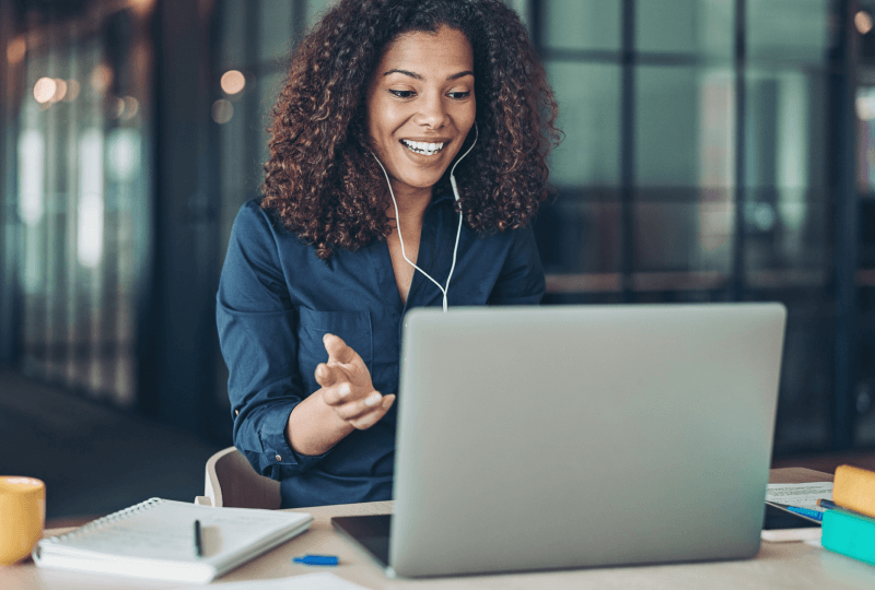 Woman interacting with a laptop.