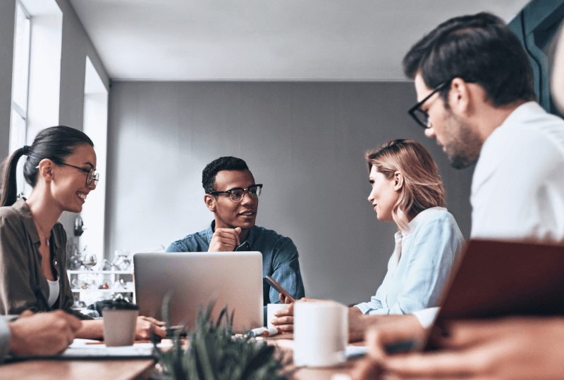 A group of people having a meeting.