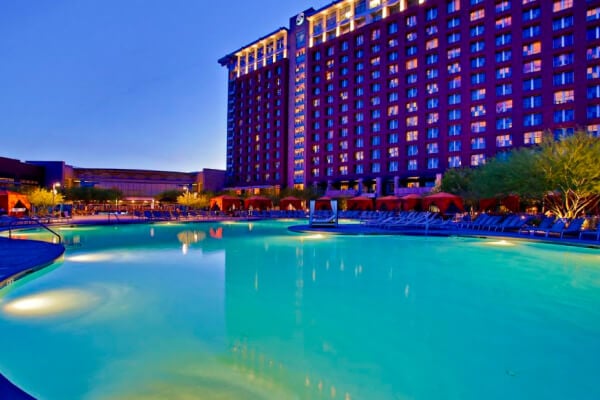 image of an outside pool infront of a hotel