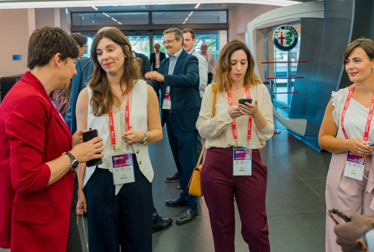 attendants wearing badges are talking to eachother