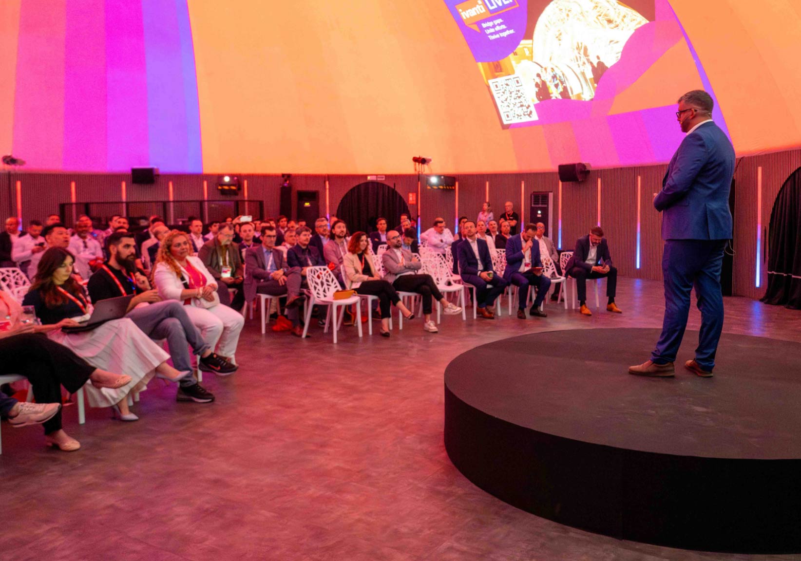 image of a presenter on a stage