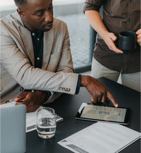 workers looking at tablet