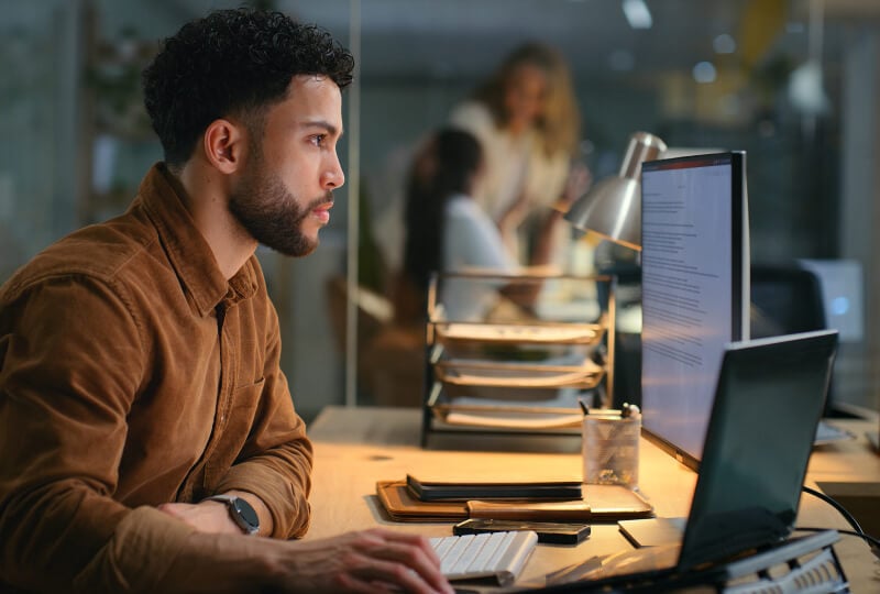 A man looking at a computer screen