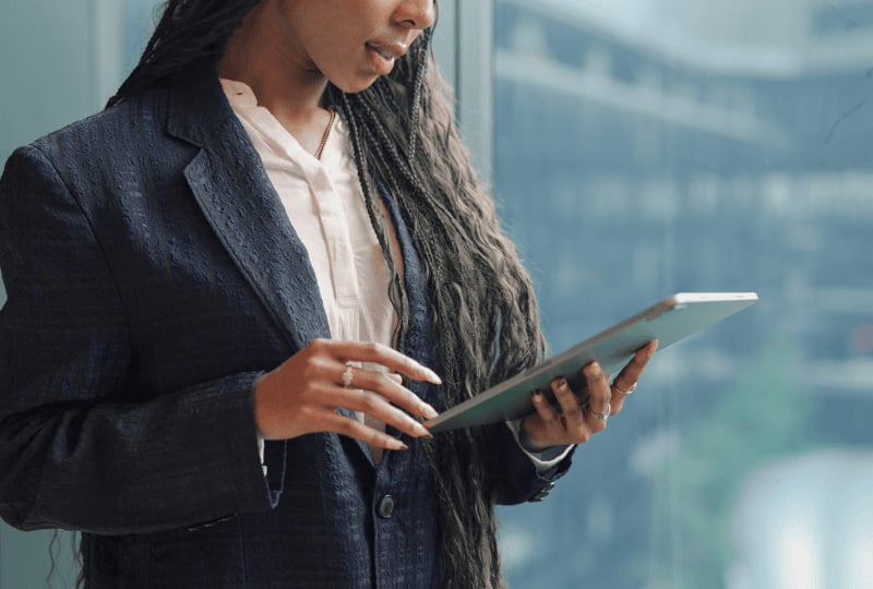 a woman using a tablet device at work