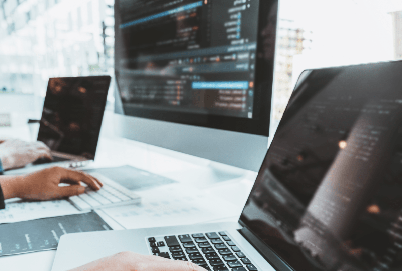 Person working at a multi monitor setup