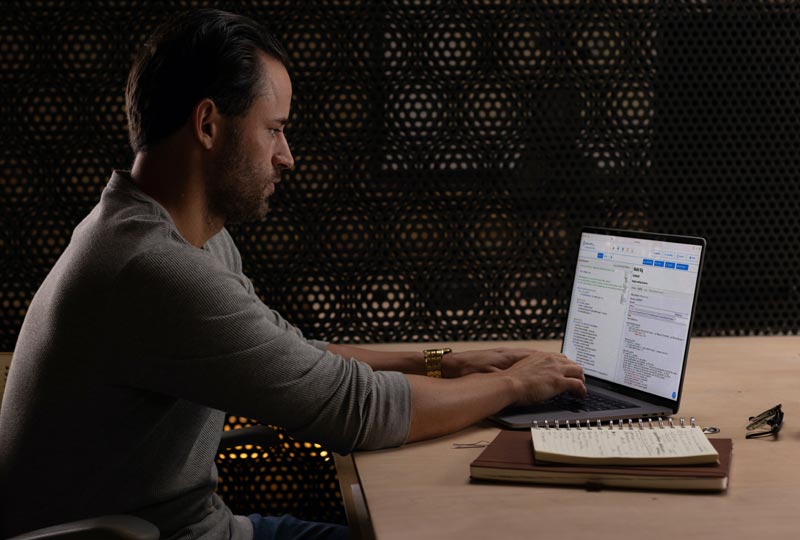 man working on his personal device