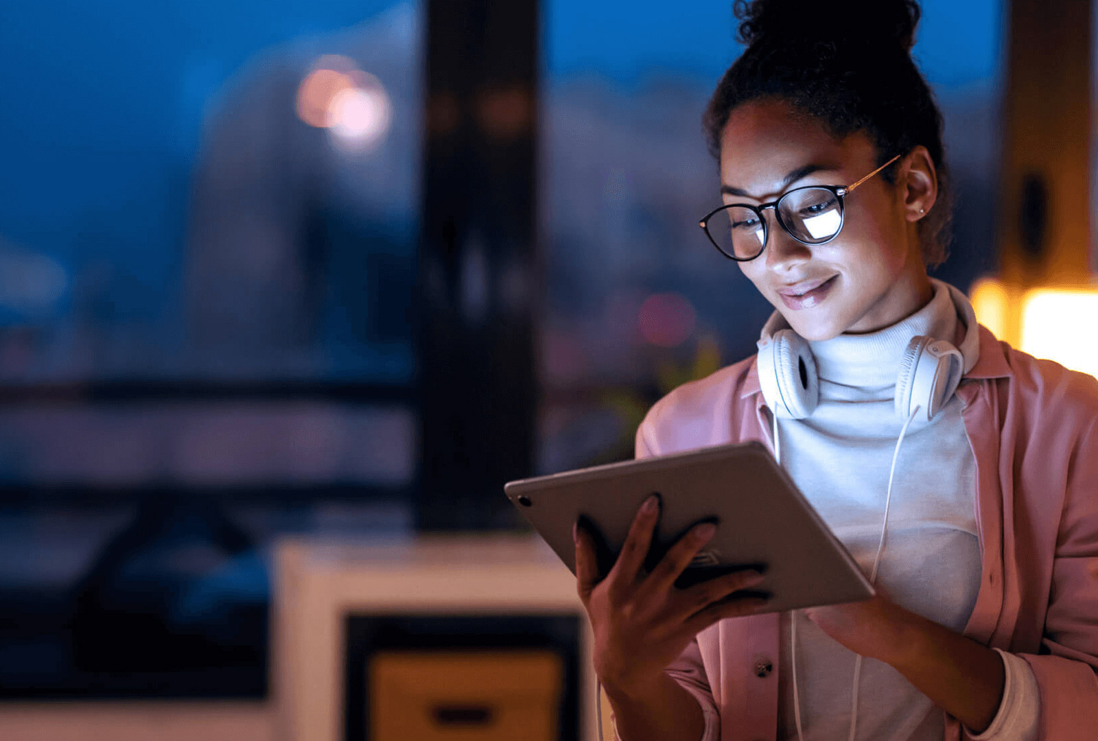 woman reading on a tablet