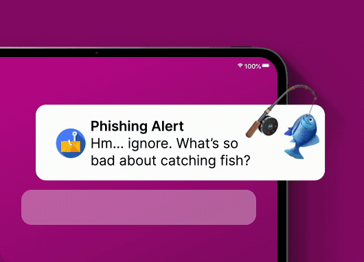 "phishing alert" notification icon floating in front of a laptop screen.