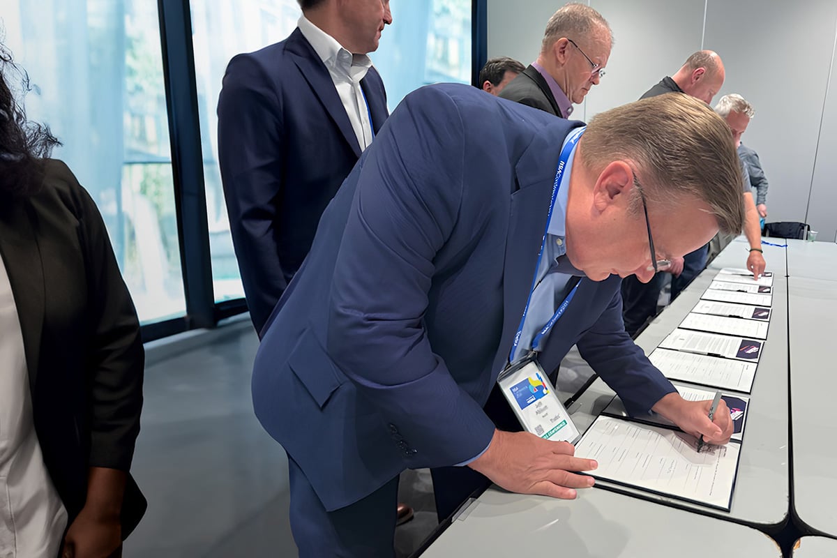 officials signing documents