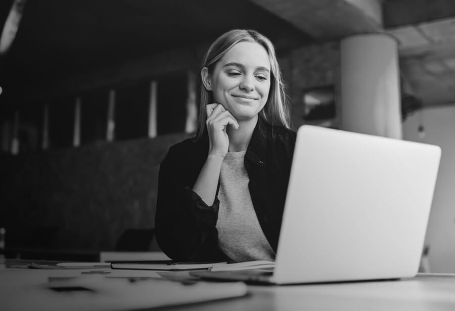 woman looking at laptop