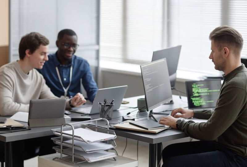 people working at a conference table