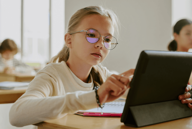 Young girl interacting with a tablet computer
