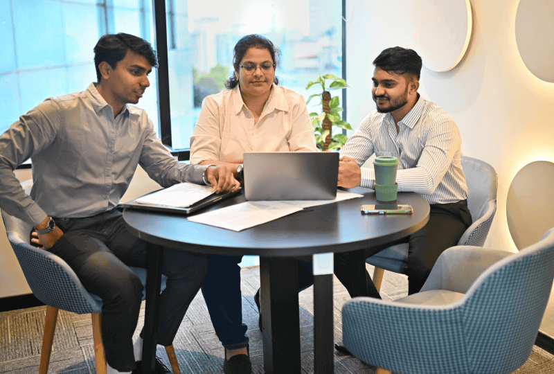 three people working at a table