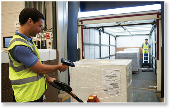 warehouse worker scanning incoming box