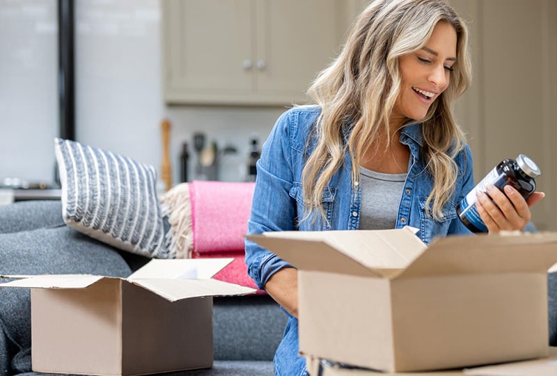 woman unpacking goods from a shipment