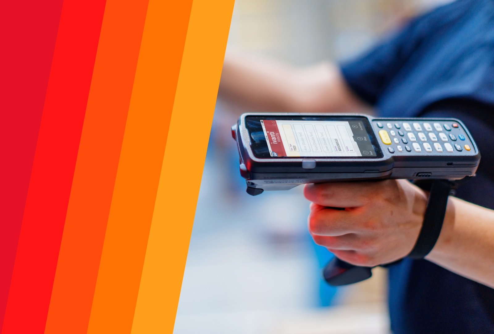 Closeup shot of a person's hand holding a mobile scanning device.