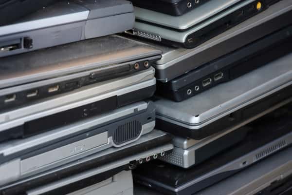 old laptops stacked on each other