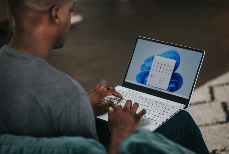 Person working on a Windows laptop