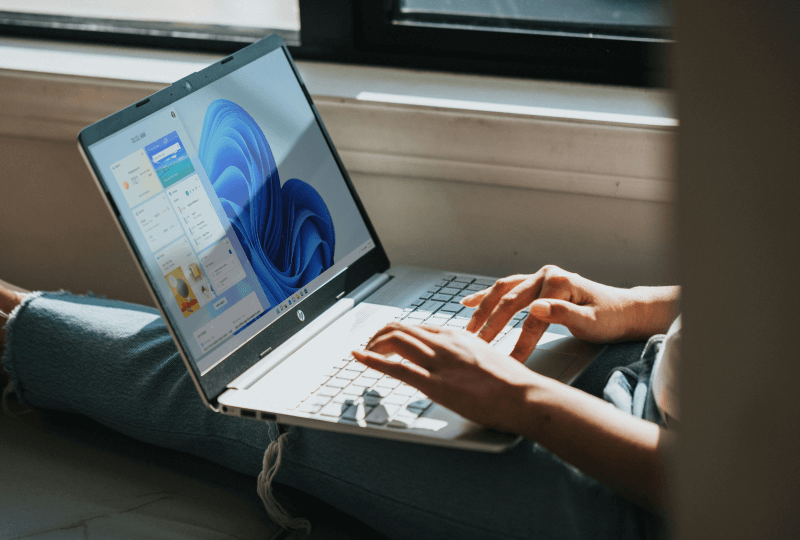Person working on a Windows laptop