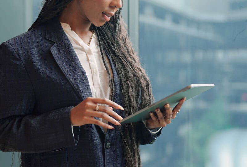 Woman interacting with a tablet computer.