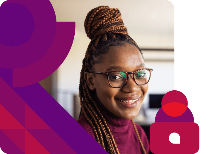 Woman with glasses smiling.